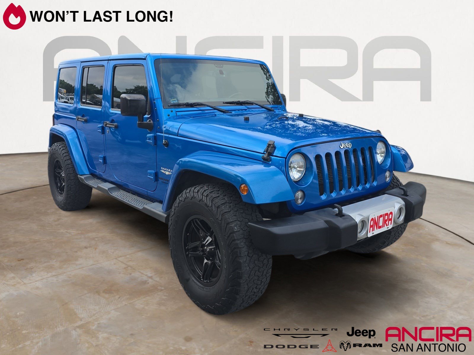 Used 2015 Hydro Blue Pearl Coat Jeep Sahara image 1