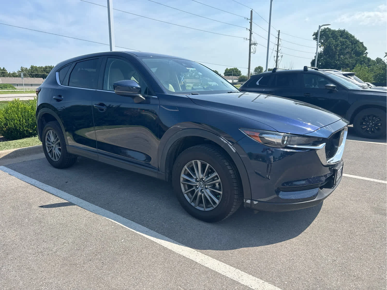 Used 2017 Deep Crystal Blue Mica Mazda Touring image 1