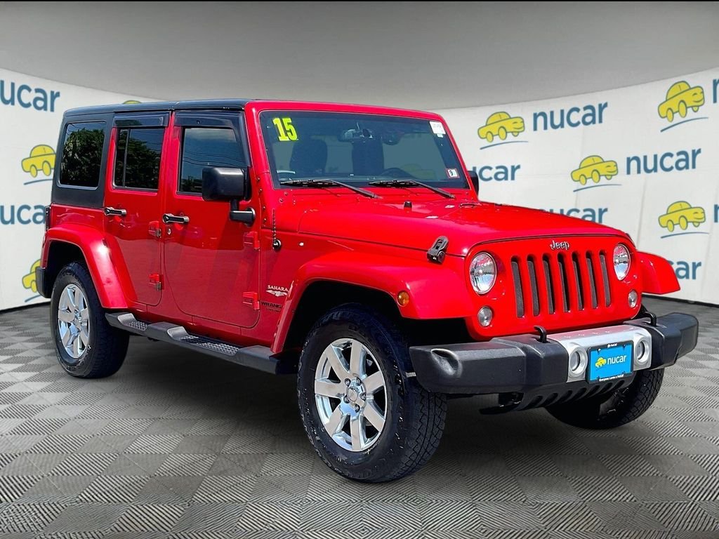 Used 2015 Red Jeep Unlimited Sahara image 1