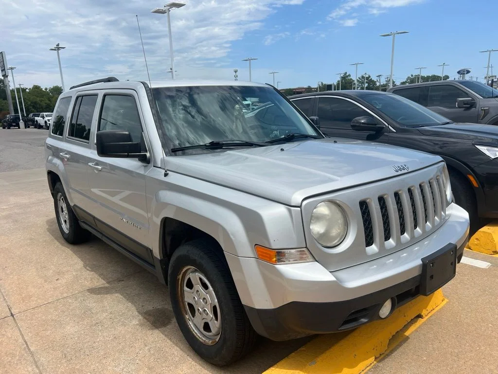 Used 2014 Silver Jeep Sport image 1