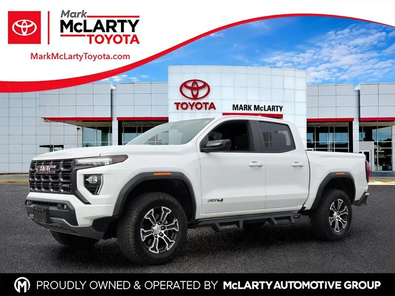 Used 2023 Summit White GMC 4WD Crew Cab AT4 image 1
