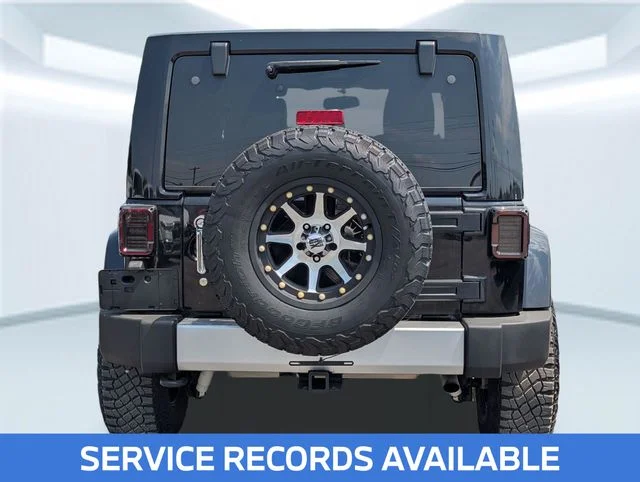 Used 2013 Black Jeep Unlimited Sahara image 4