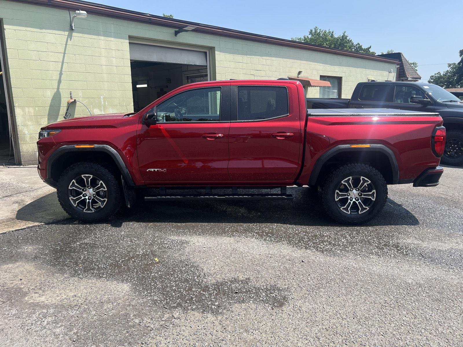 Used 2024 Volcanic Red Tintcoat GMC 4WD AT4 image 6