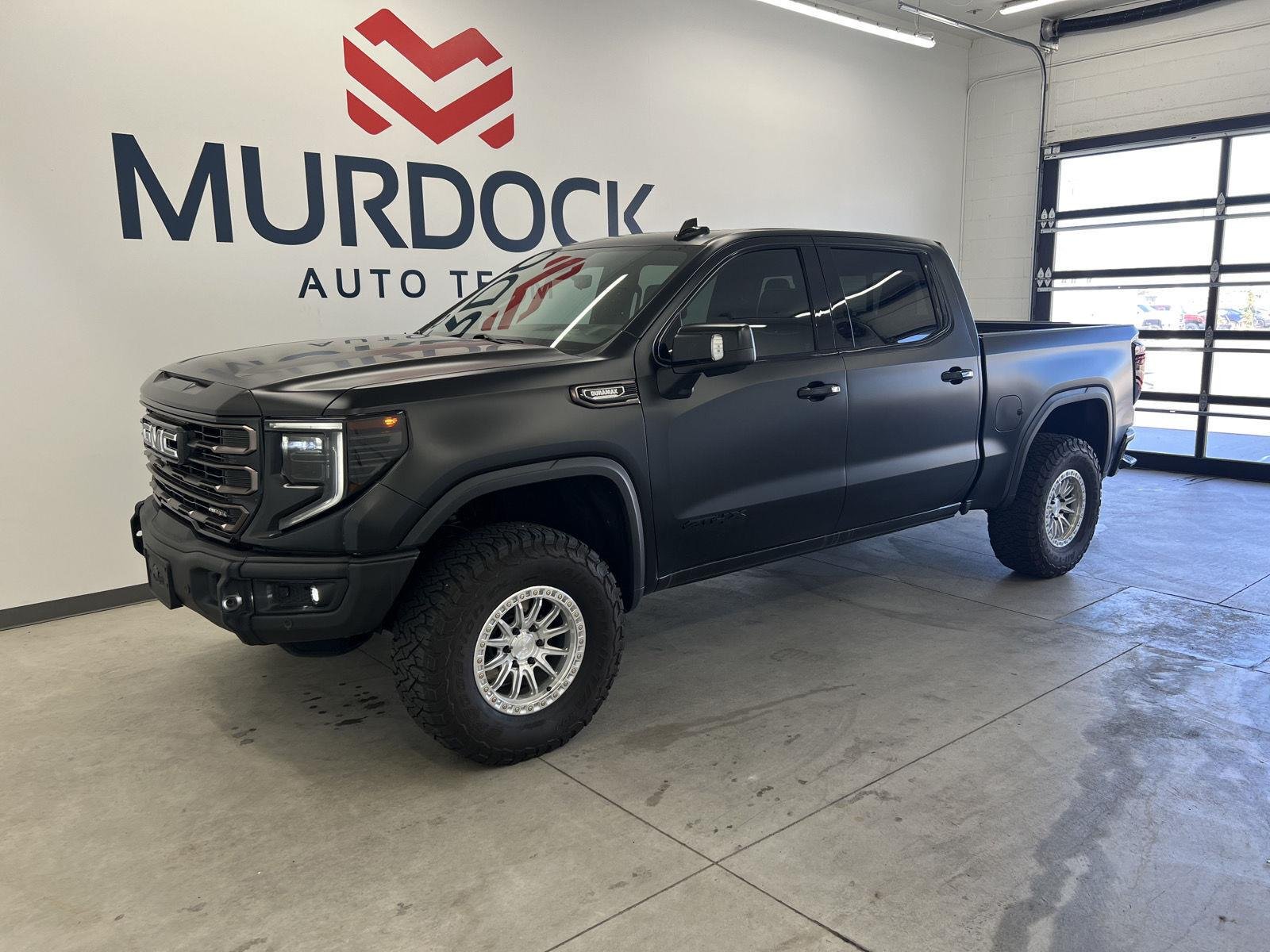 Used 2025 Onyx Black GMC AT4X image 1
