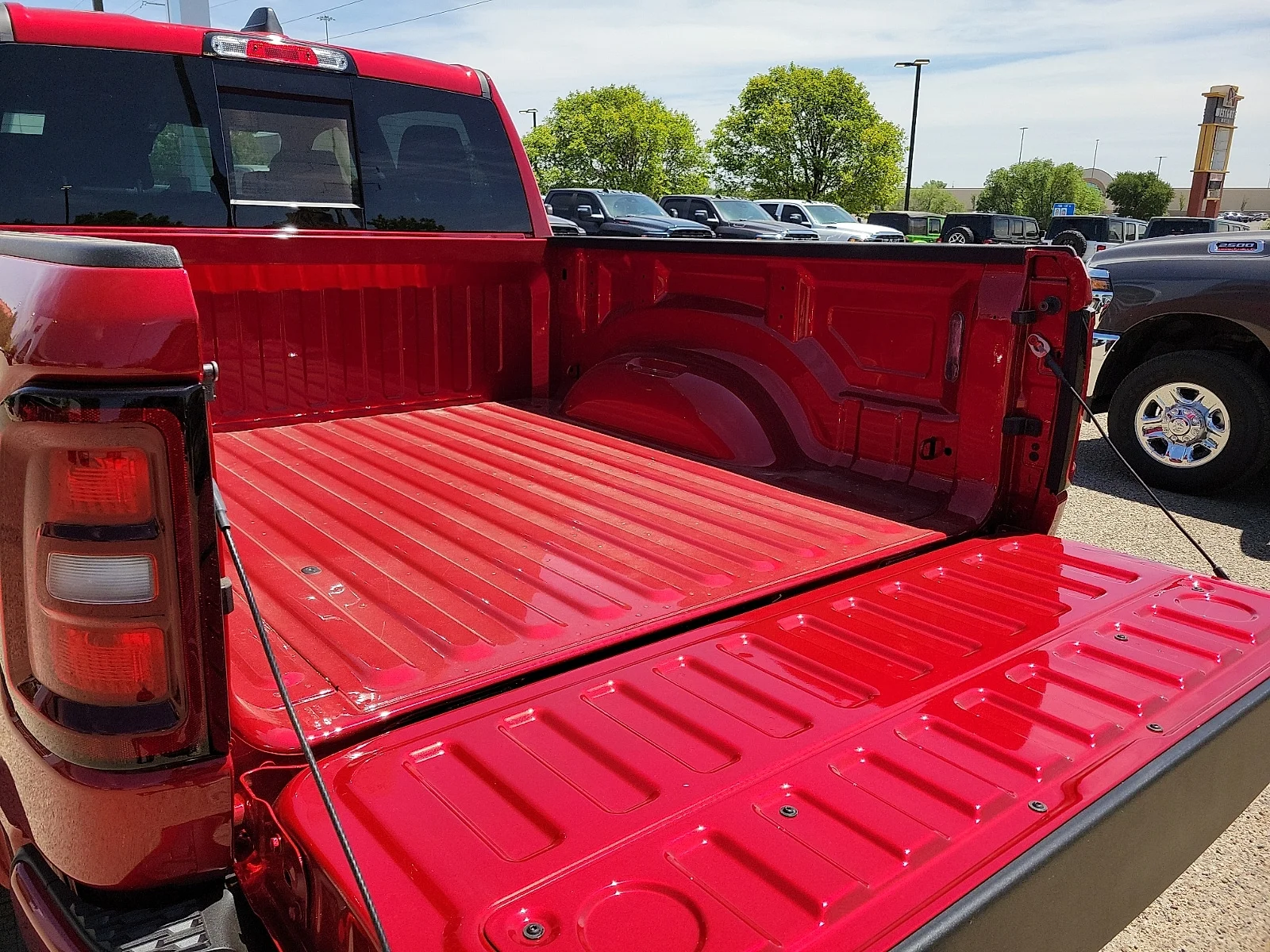 New 2026 PR6 Molten Red Ram LARAMIE CREW CAB 4X4 5