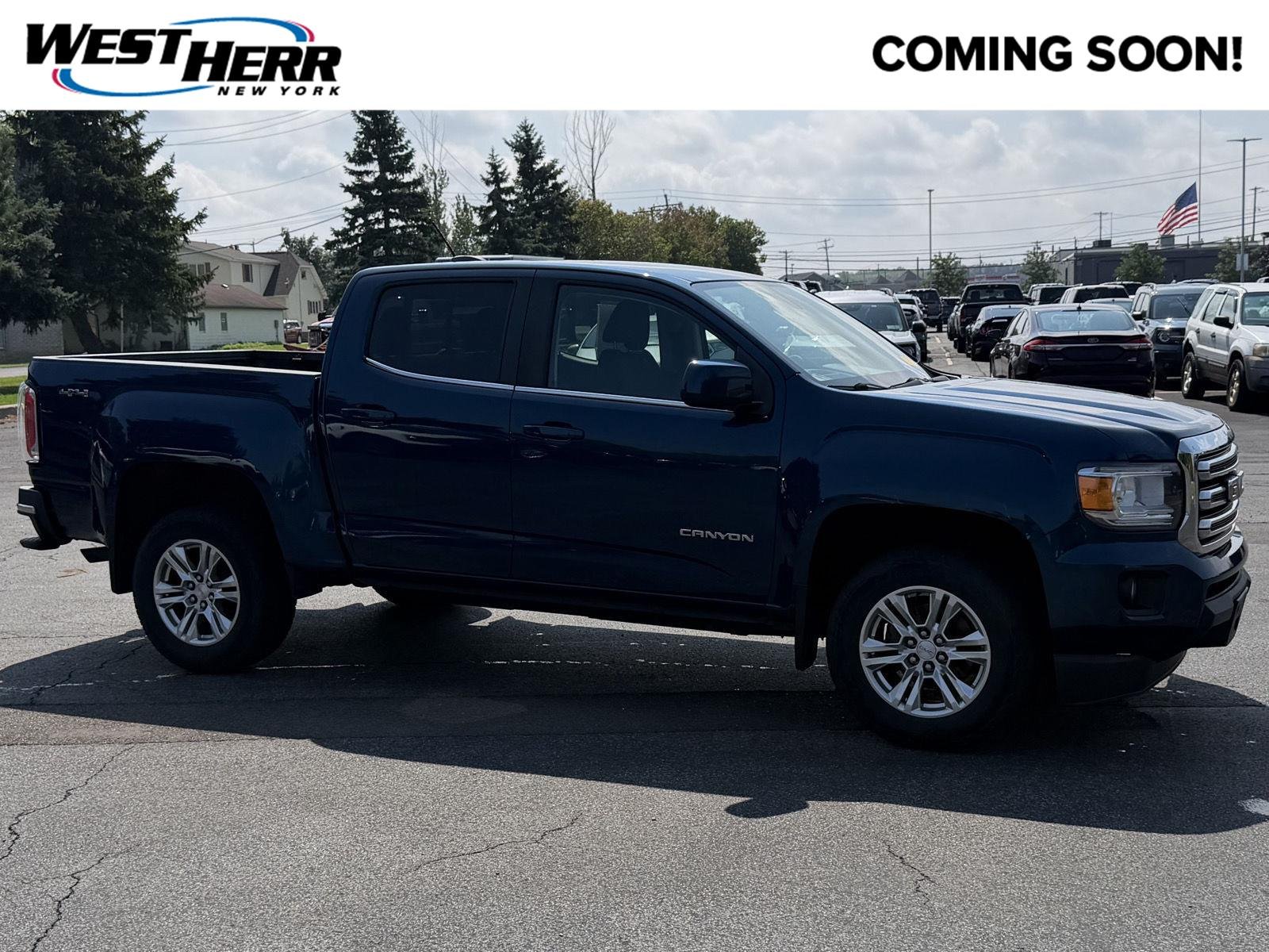 Used 2020 Blue Emerald Metallic GMC 4WD SLE image 1