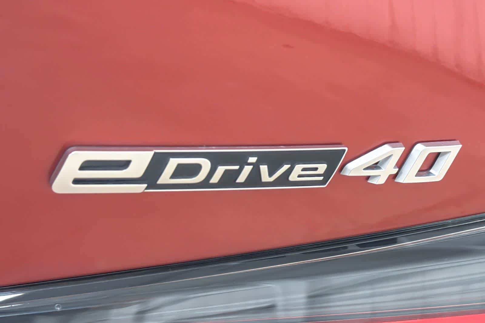 Used 2024 Sunset Orange Metallic BMW eDrive40 image 27