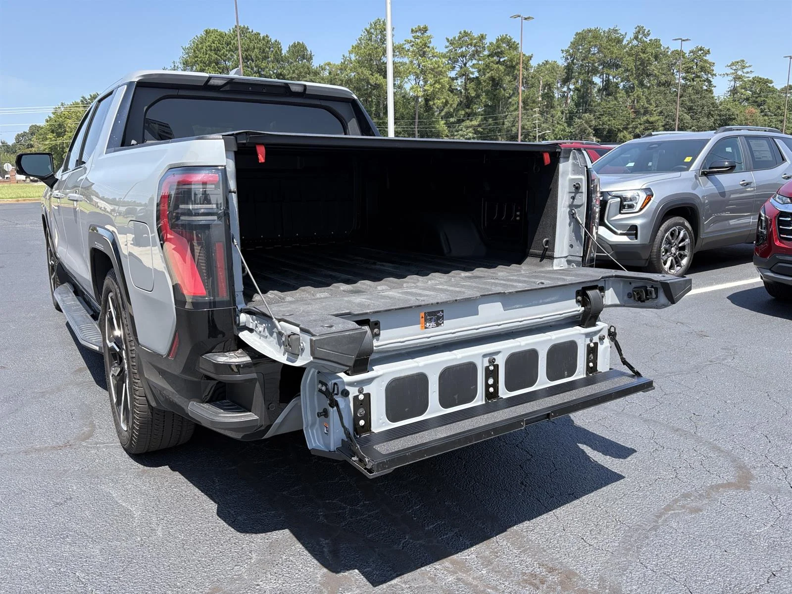 Used 2025 Thunderstorm Gray GMC Max Range Denali image 7