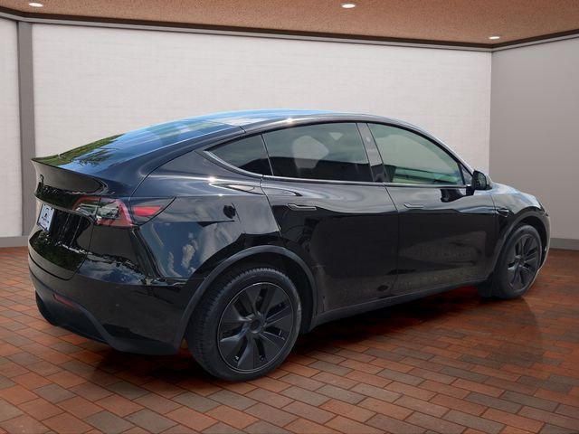 Used 2024 Solid Black Tesla Long Range image 3