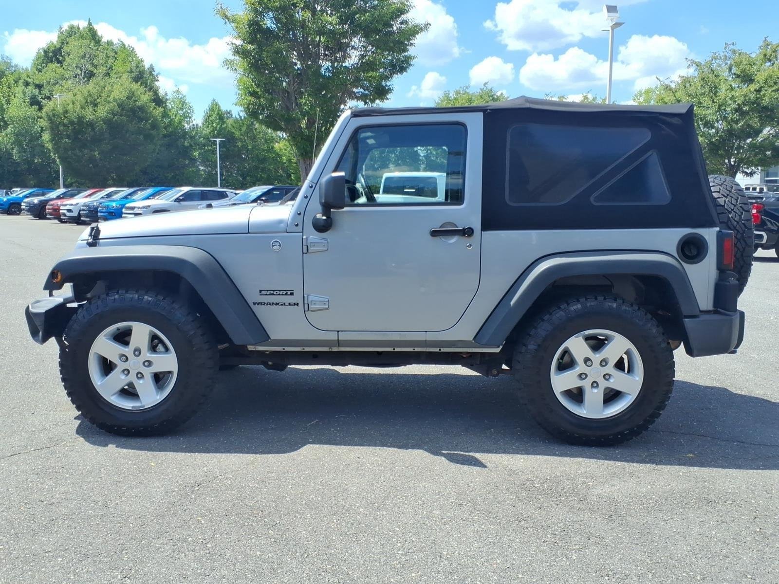 Used 2015 Billet Silver Metallic Clearcoat Jeep Sport image 3