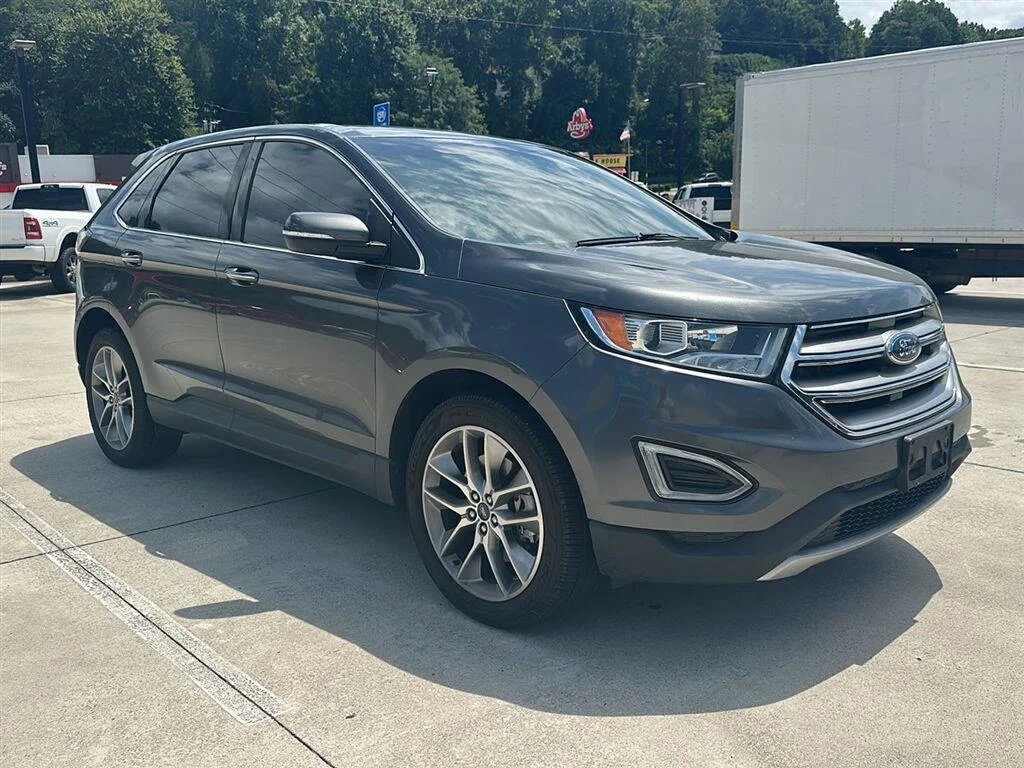 Used 2017 Magnetic Metallic Ford Titanium image 1