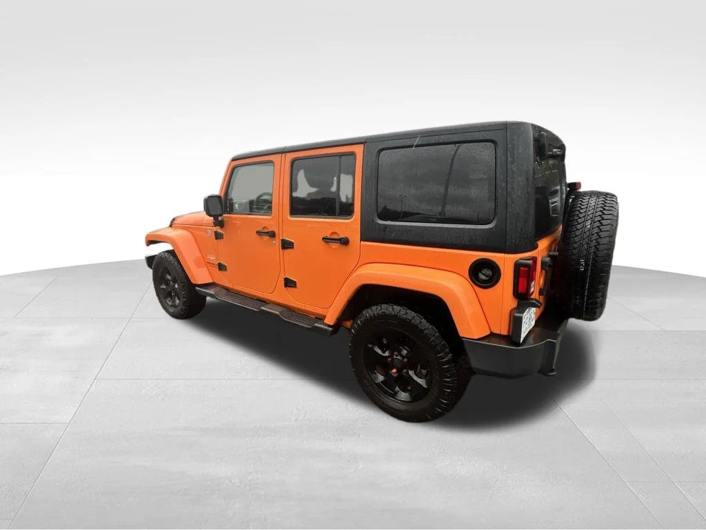 Used 2013 Orange Jeep Unlimited Sahara image 9