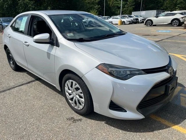 Used 2018 Classic Silver Metallic Toyota LE image 1