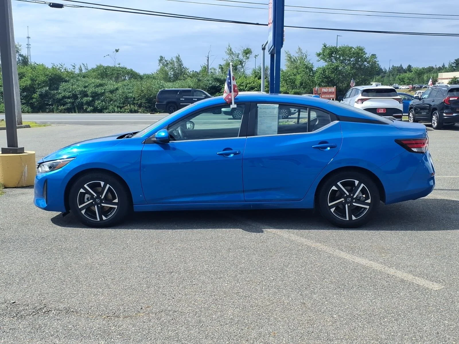 Used 2025 Electric Blue Metallic Nissan SV image 8