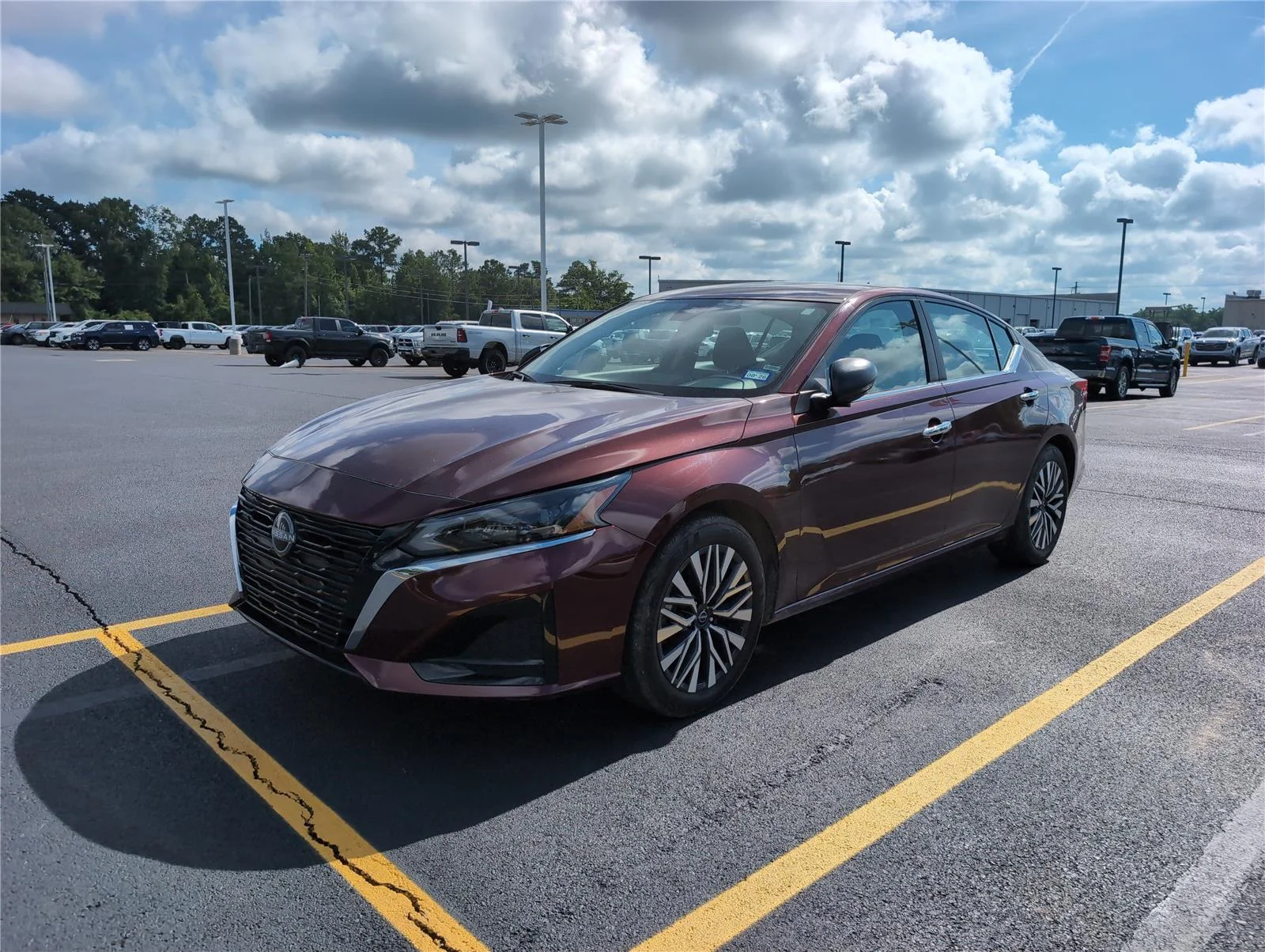 Used 2025 Garnet Pearl Metallic Nissan SV image 1
