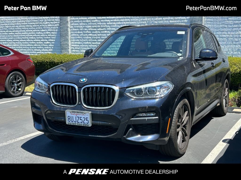 Used 2021 Carbon Black Metallic BMW xDrive30i image 1