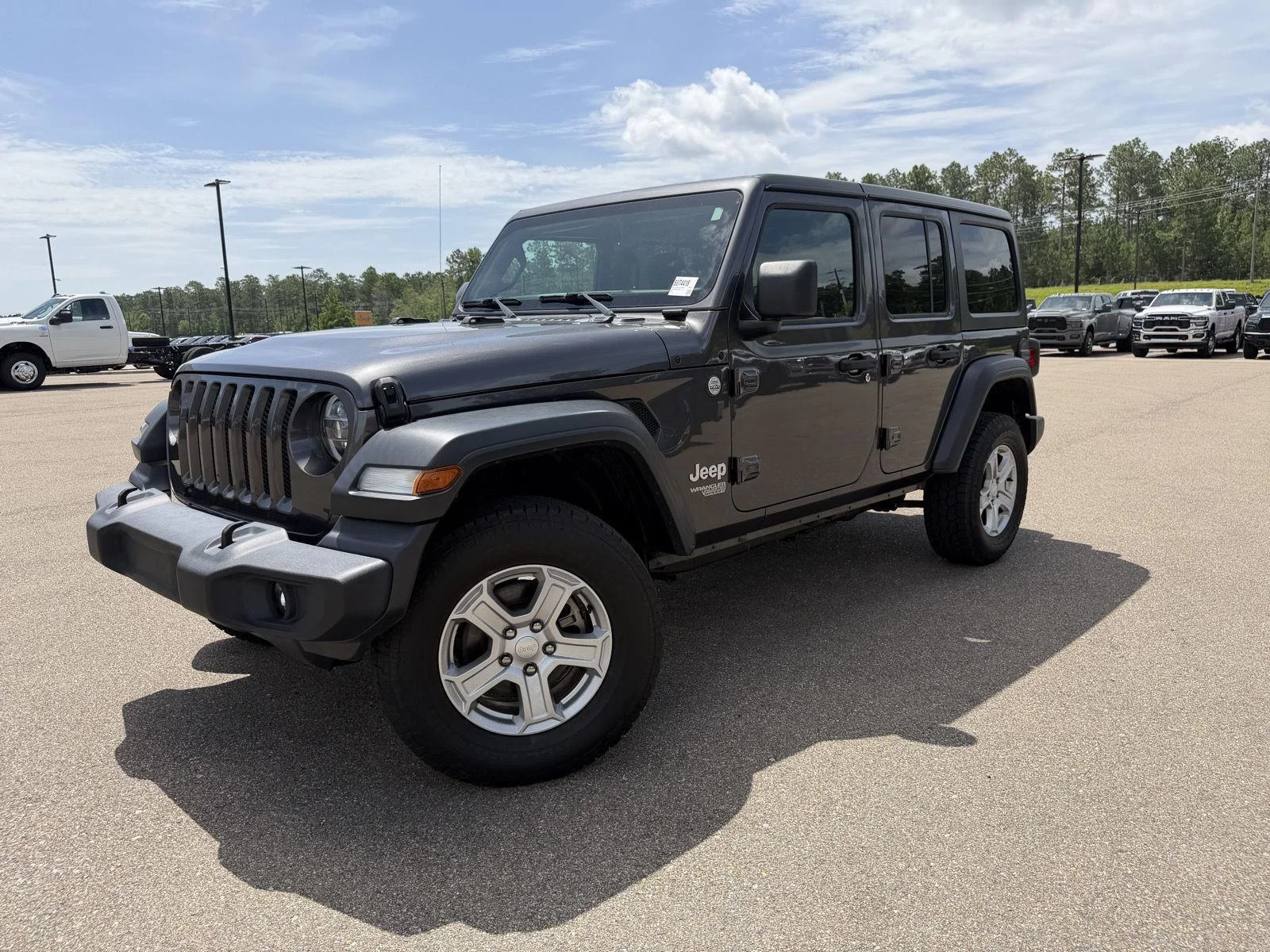 Used 2020 Granite Crystal Metallic Clearcoat Jeep Sport S image 1