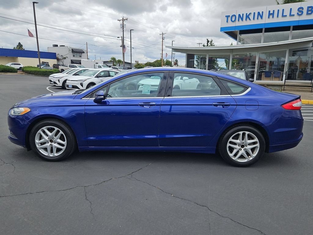 Used 2014 Blue Metallic Ford SE image 3