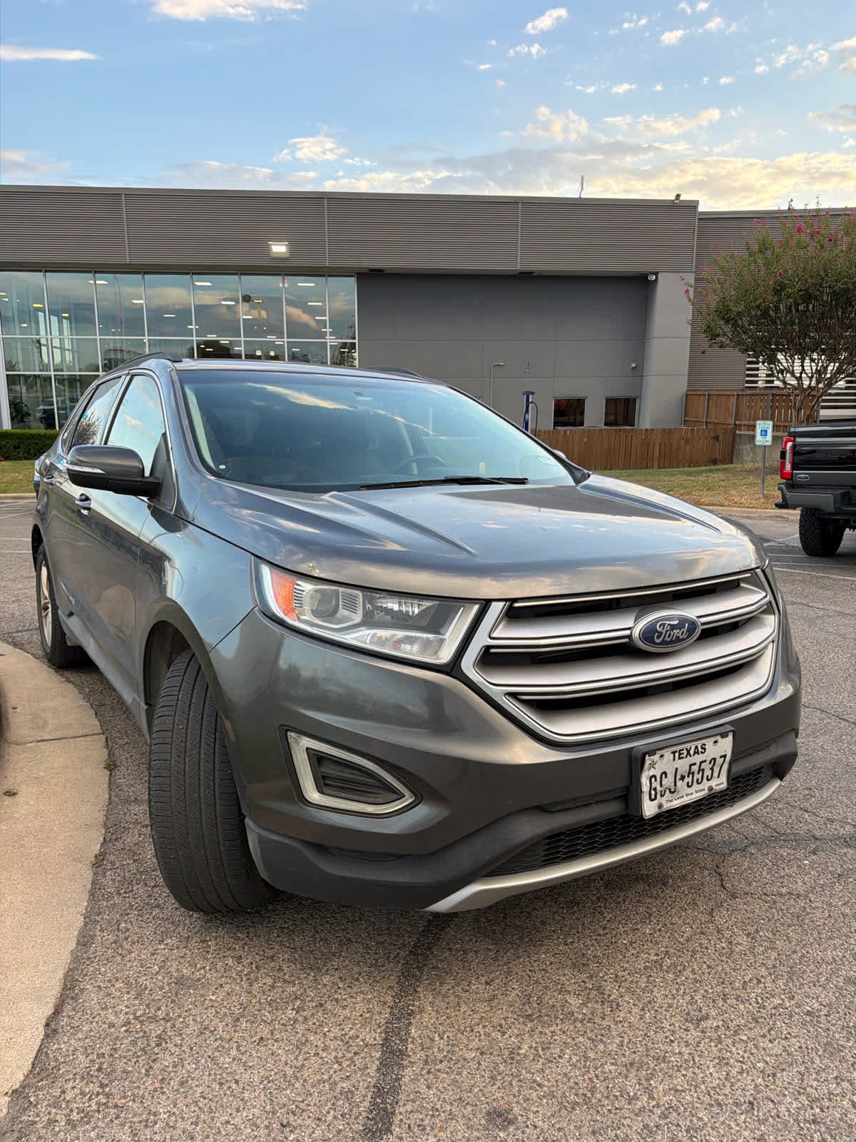Used 2015 Magnetic Metallic Ford SEL image 4