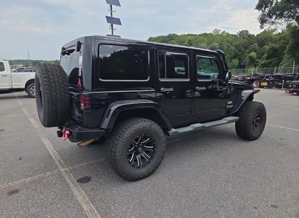 Used 2014 Black Clearcoat Jeep Sahara image 4