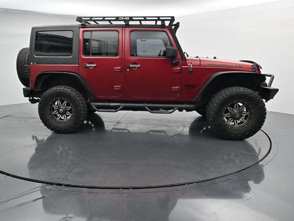 Used 2012 Red Jeep Unlimited Sport image 9