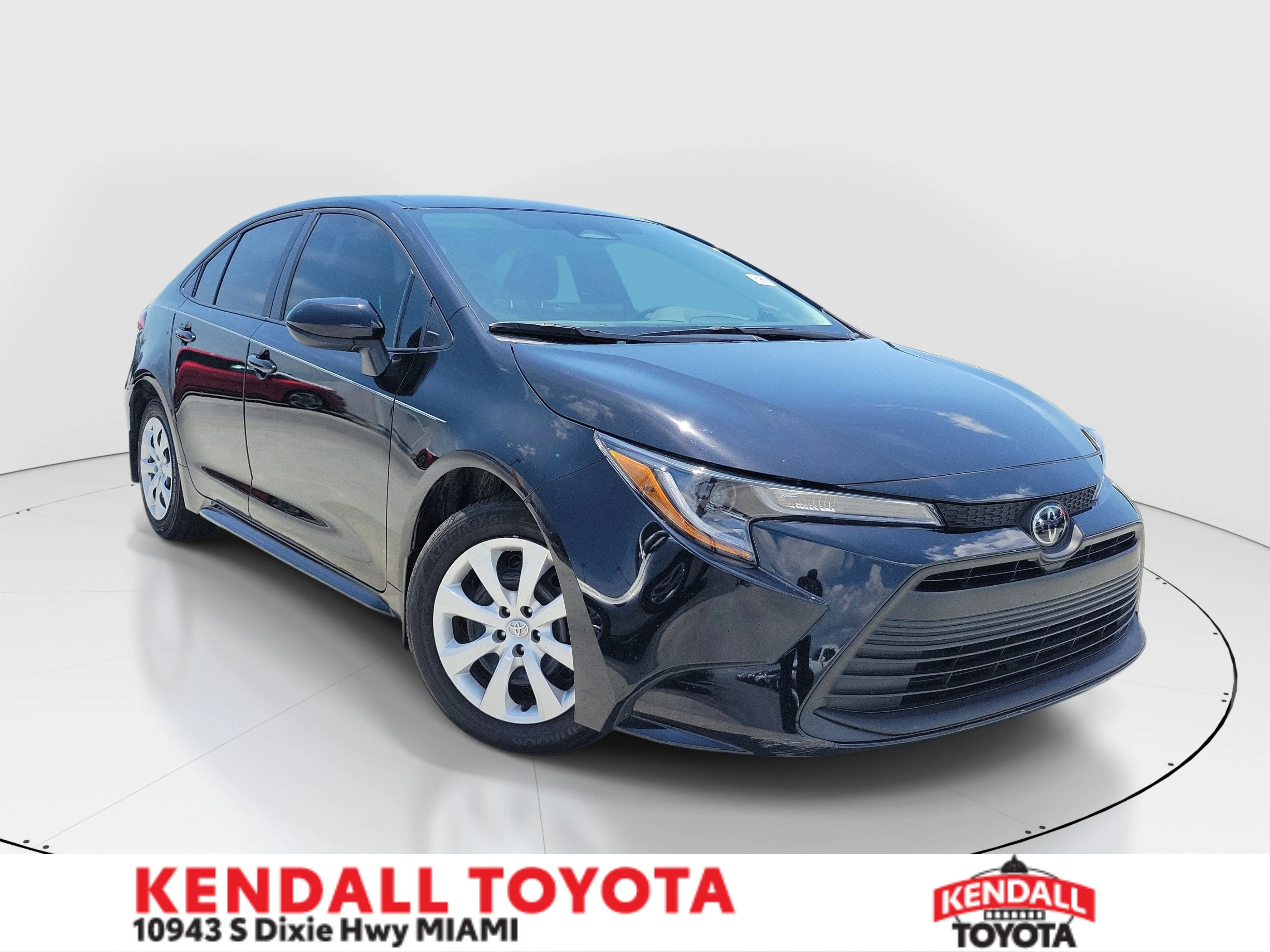 Used 2025 Midnight Black Metallic Toyota LE image 1