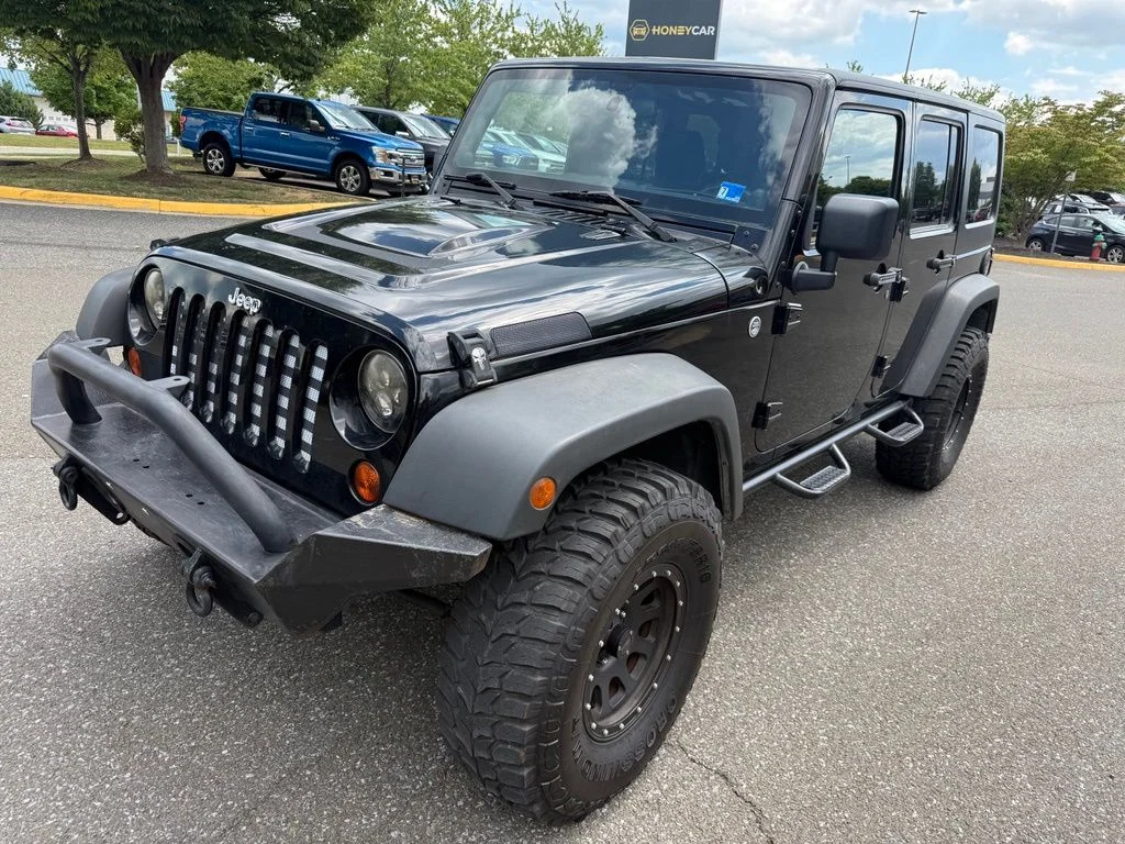 Used 2011 Black Jeep Unlimited Sport image 3