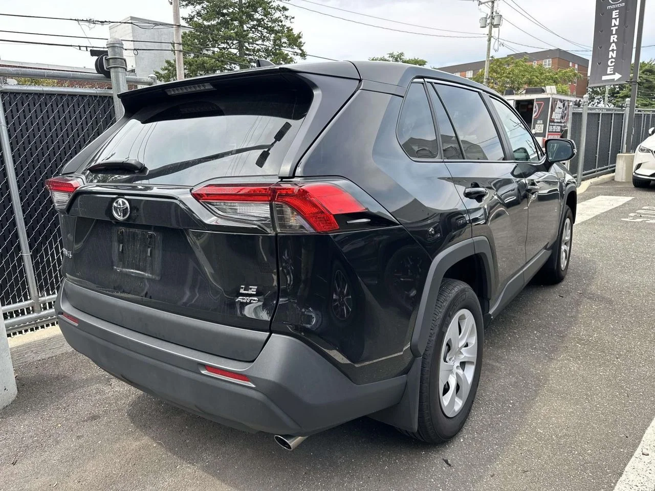 Used 2025 Midnight Black Metallic Toyota LE image 2