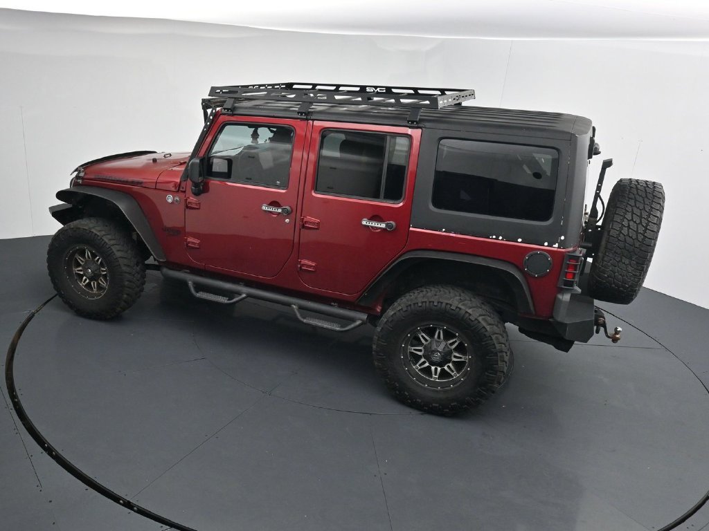 Used 2012 Red Jeep Unlimited Sport image 13
