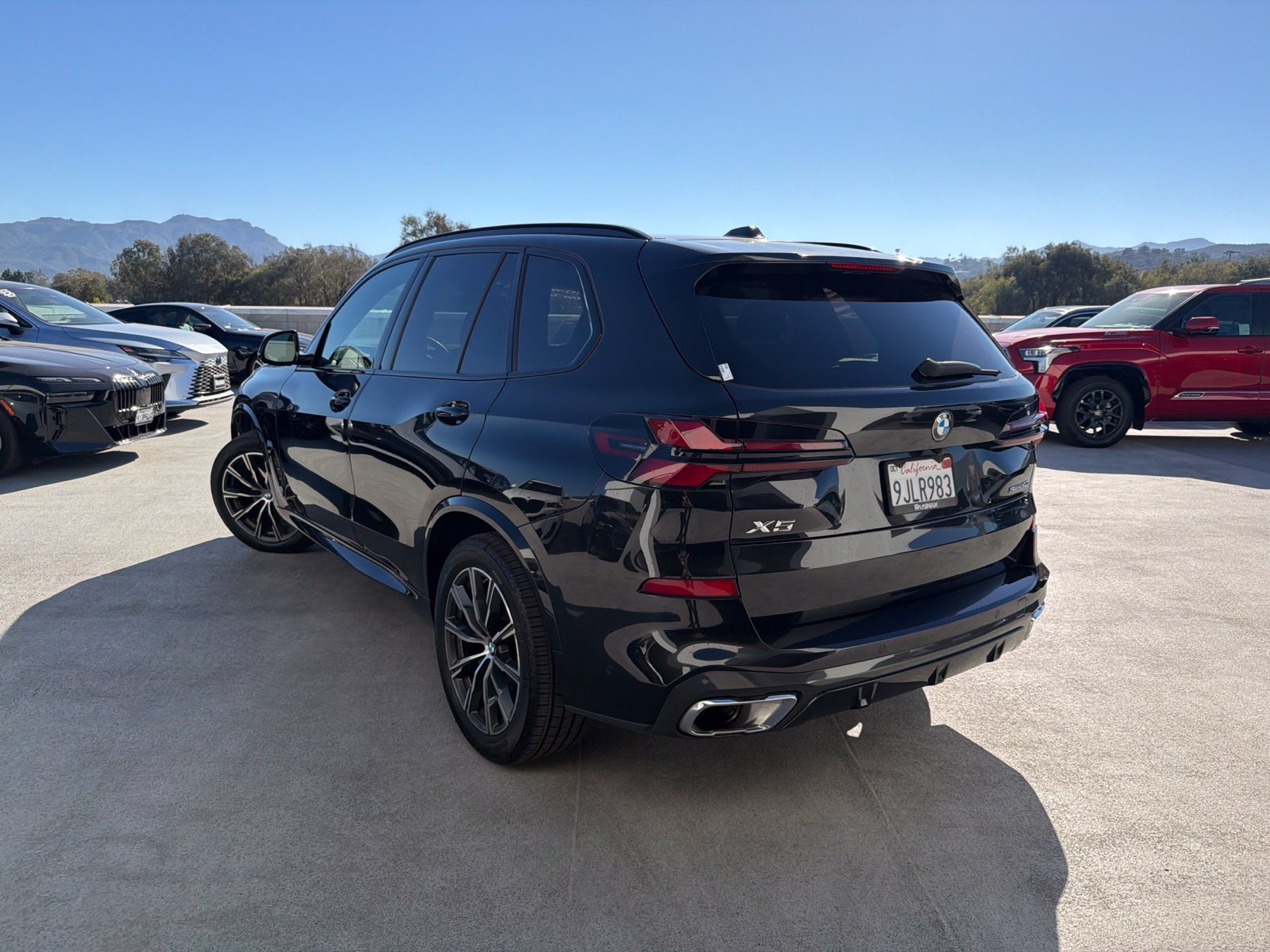 Used 2024 Black Sapphire Metallic BMW sDrive40i image 2