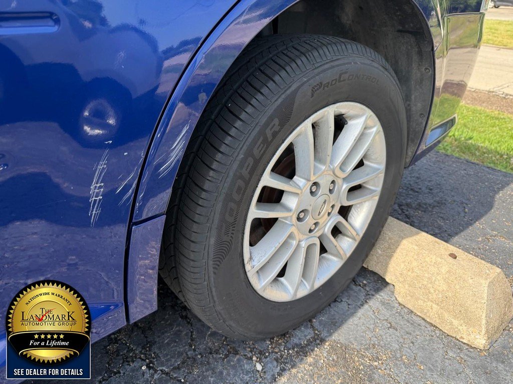 Used 2014 Deep Impact Blue Metallic Ford 4dr SEL AWD image 3
