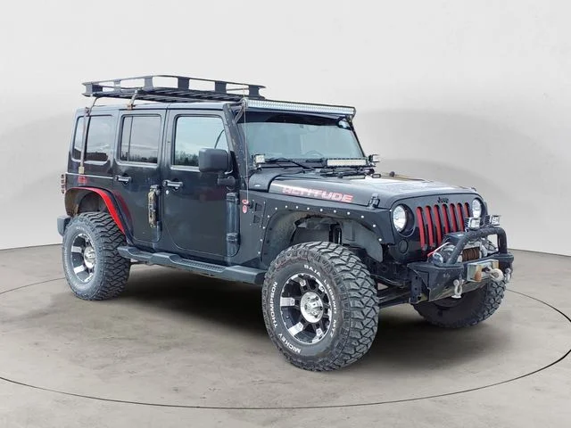 Used 2012 Black Jeep Unlimited Sahara Altitude image 7