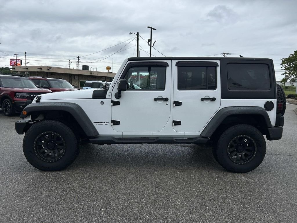 Used 2012 Bright White Jeep Unlimited Sport image 7