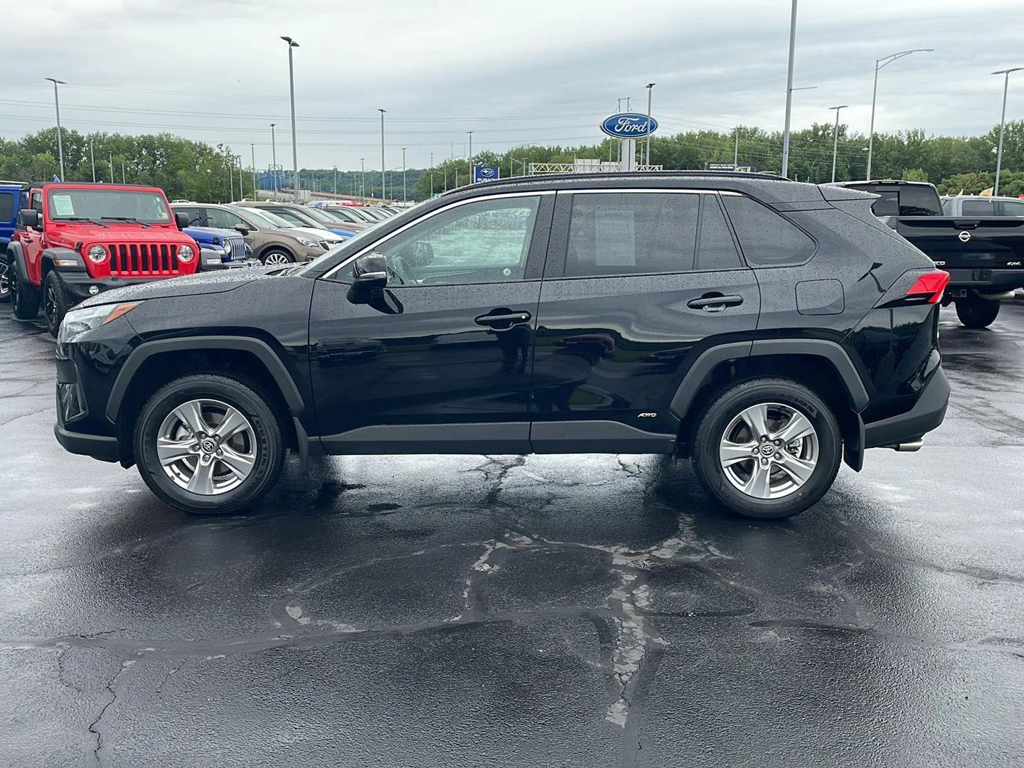 Used 2025 MIDNIGHT BLACK METALLIC TOYOTA TRUCK HYBRID XLE image 2