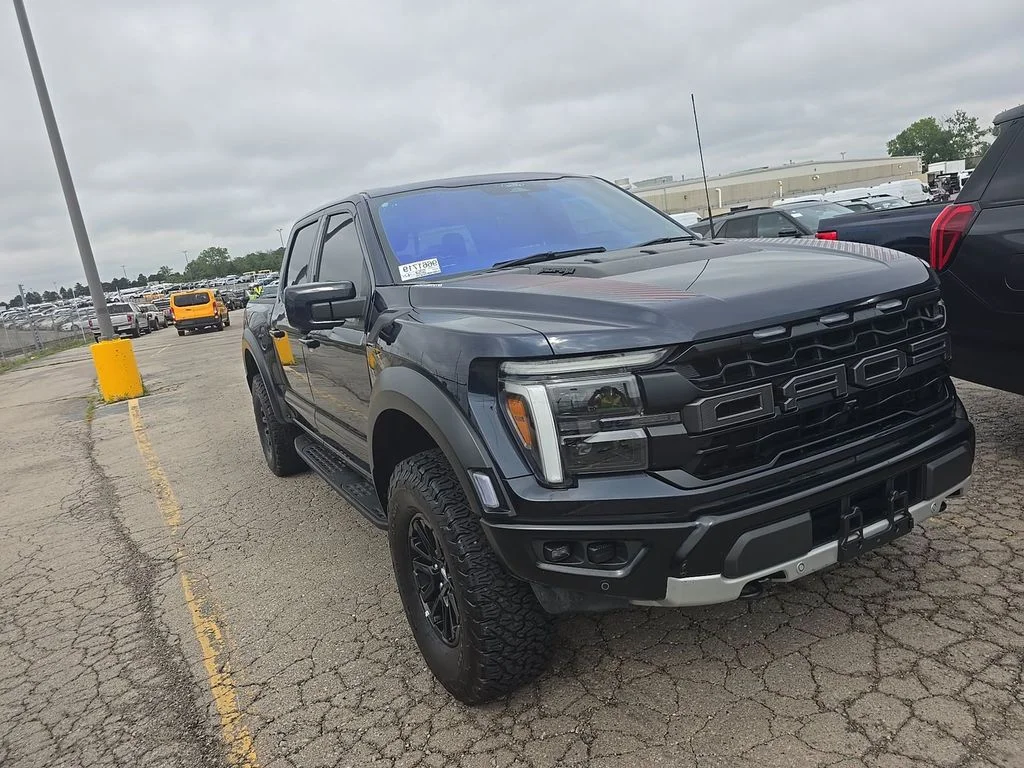 Used 2024 Blue Metallic Ford Raptor image 1