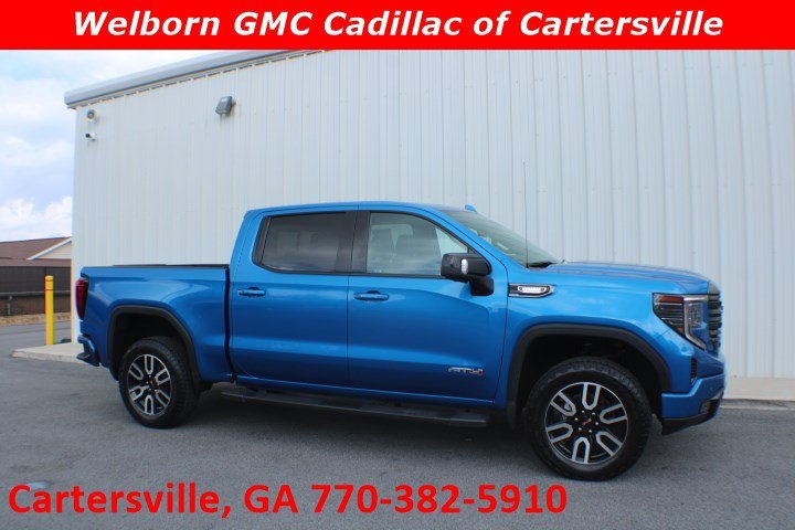 Used 2023 Dynamic Blue Metallic GMC AT4 image 1