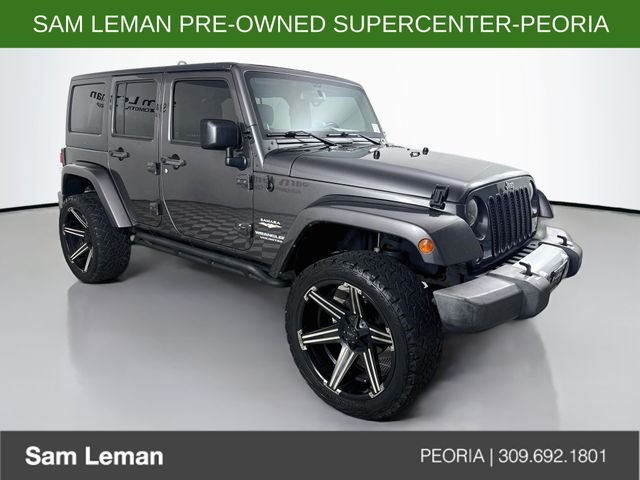 Used 2014 Gray Jeep Unlimited Sahara image 1