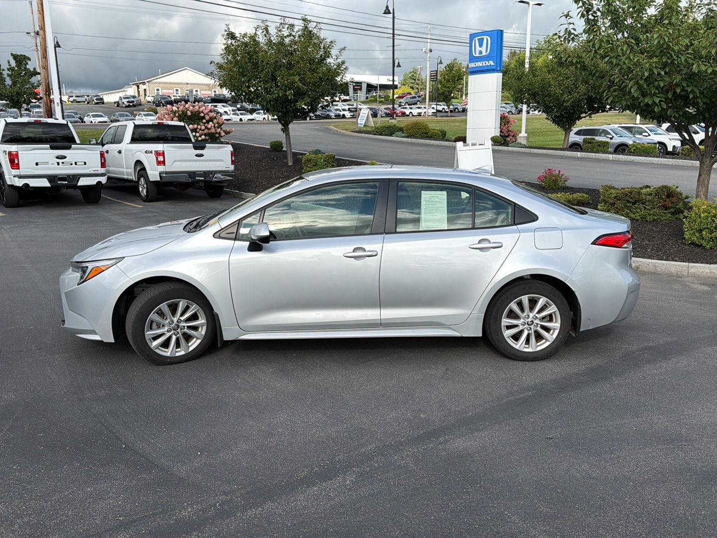 Used 2024 Classic Silver Metallic Toyota Hybrid LE image 4