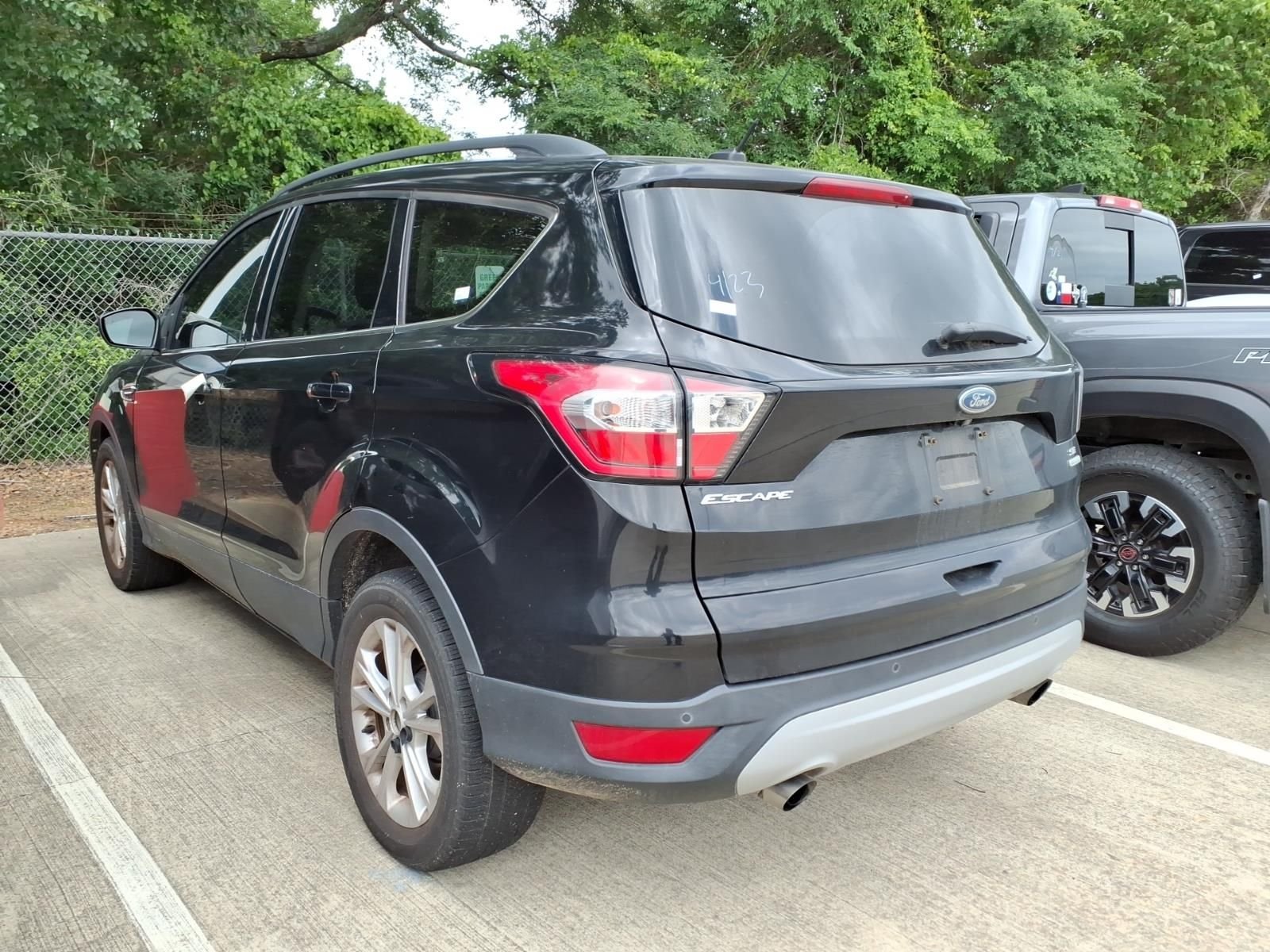 Used 2017 Ford Escape SE with VIN 1FMCU0G97HUE07223 for sale in Conroe, TX