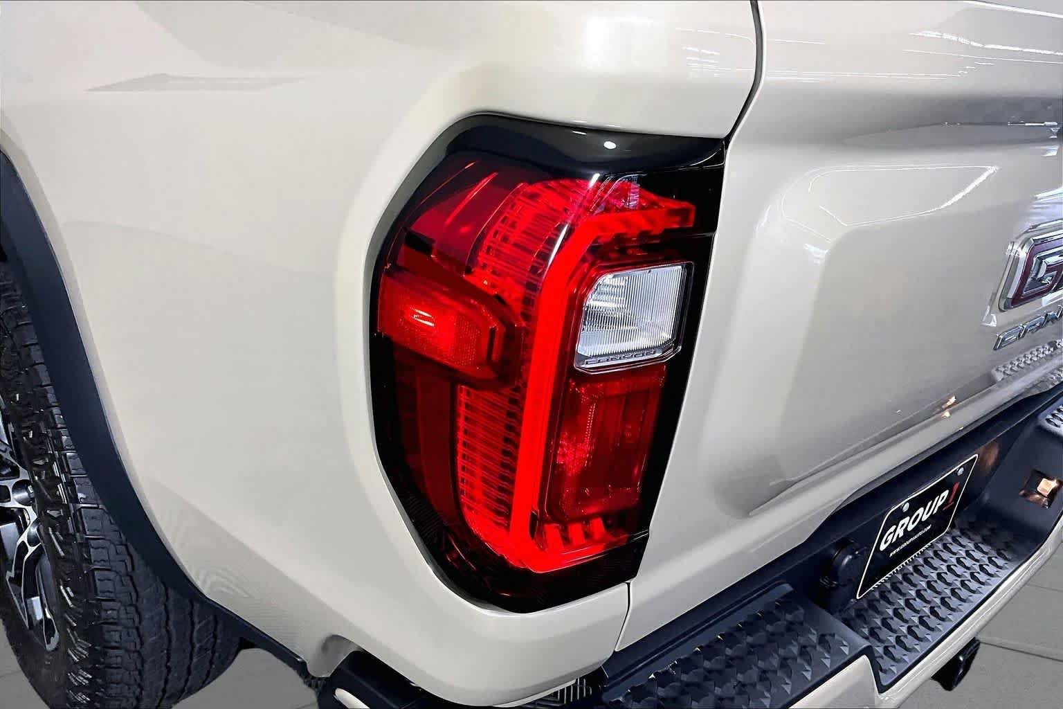 Used 2024 Desert Sand Metallic GMC 4WD AT4 image 24