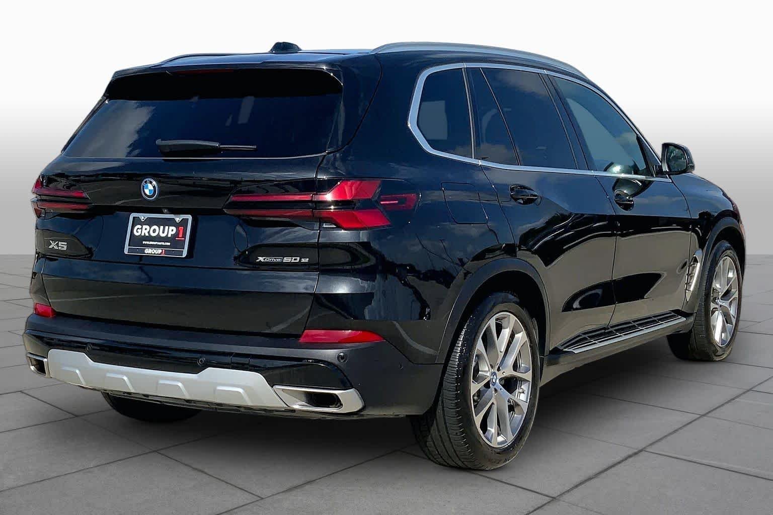 Used 2025 Black Sapphire Metallic BMW xDrive50e image 13