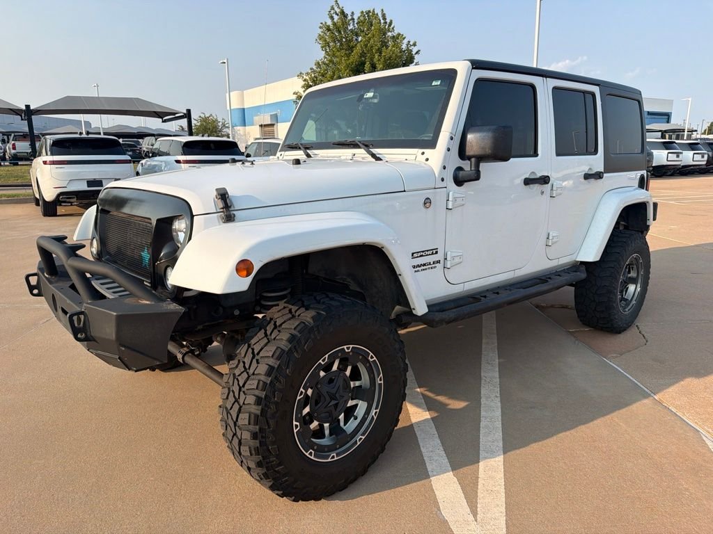 Used 2015 White Jeep Unlimited Sport image 1