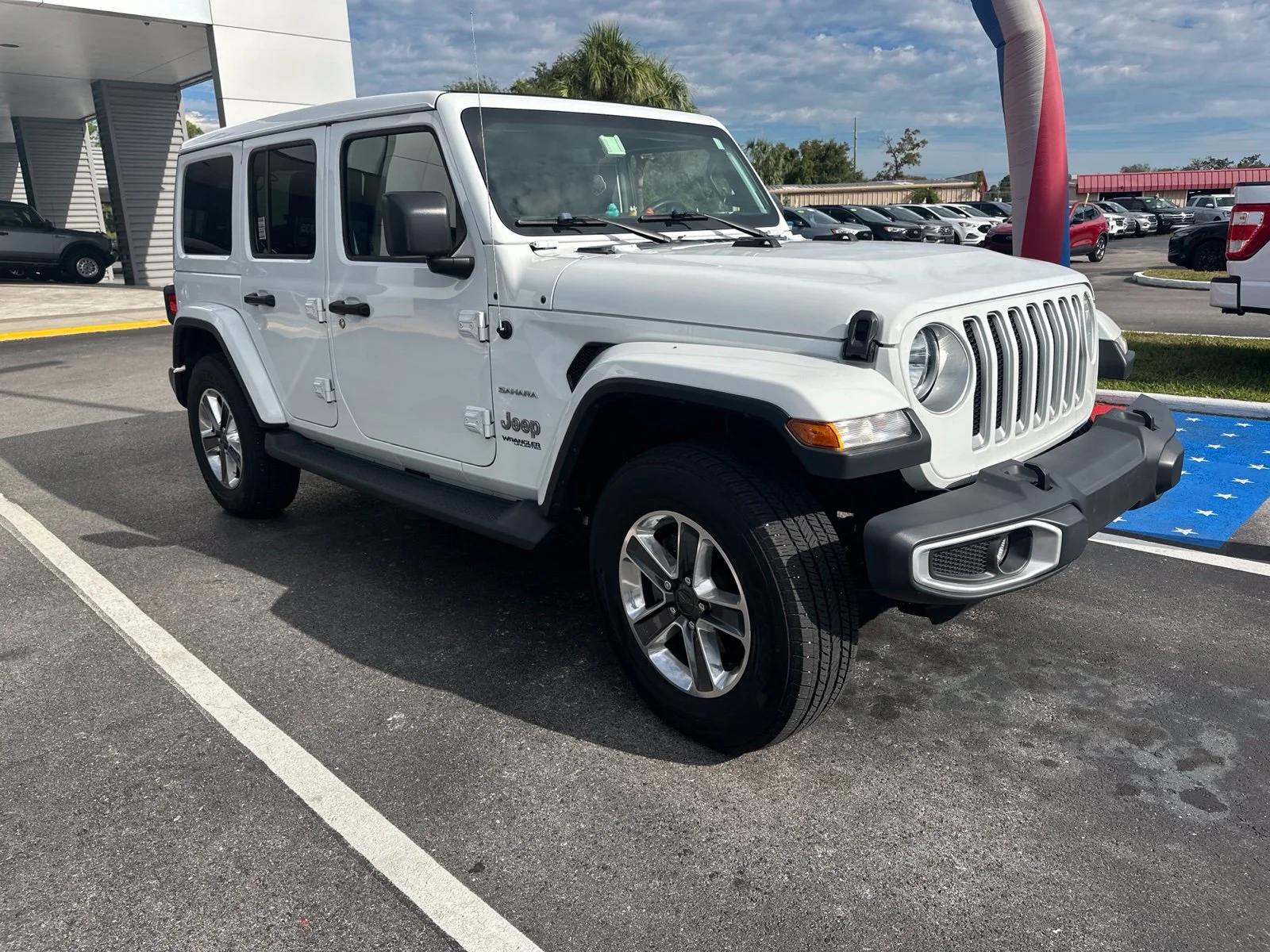 Used 2019 White Jeep Unlimited Sahara image 1