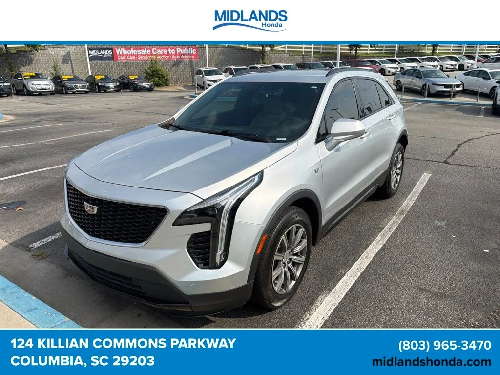 Used 2019 Radiant Silver Metallic Cadillac Sport image 1