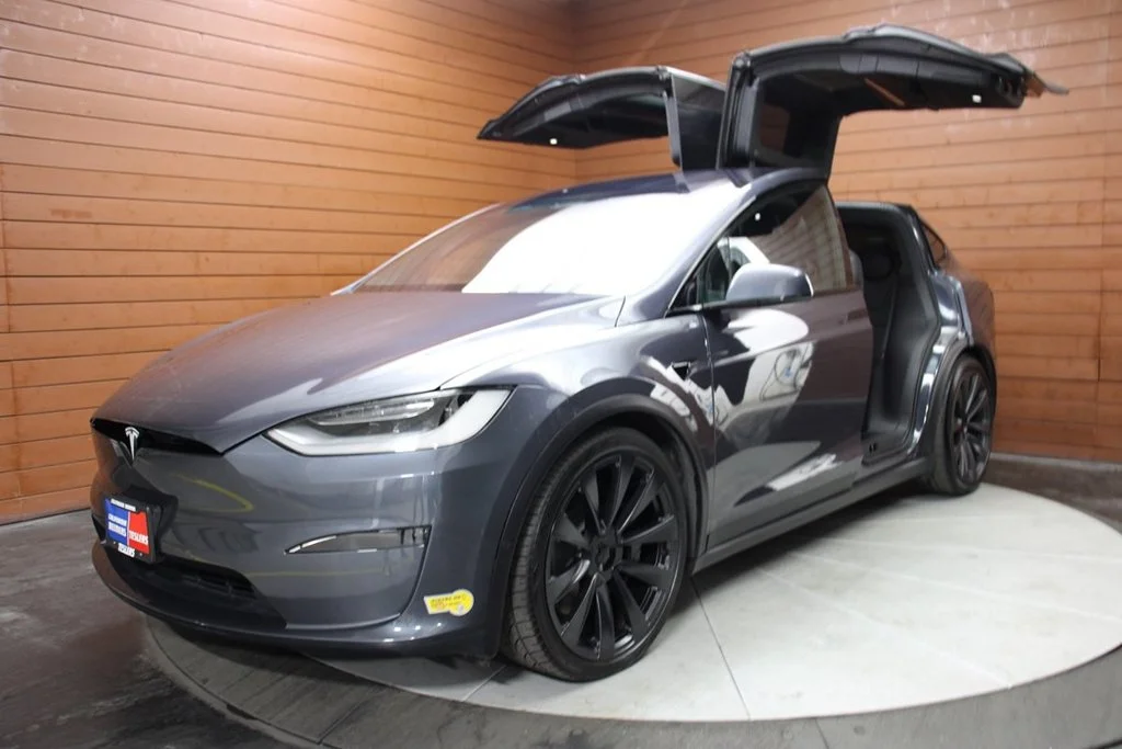 Used 2022 Solid Black Tesla Plaid image 1