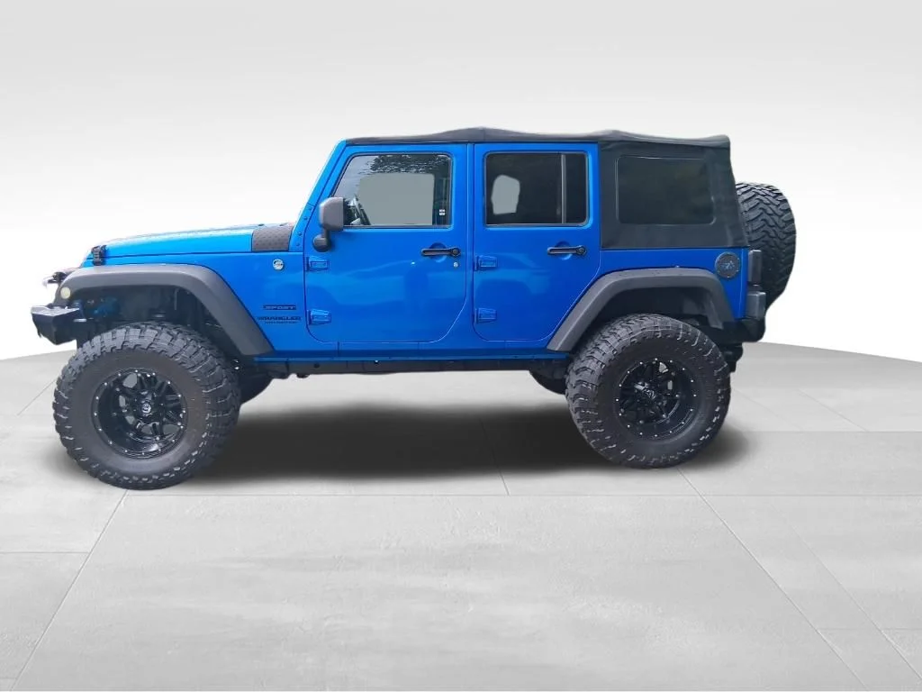 Used 2015 Blue Jeep Unlimited Sport image 2