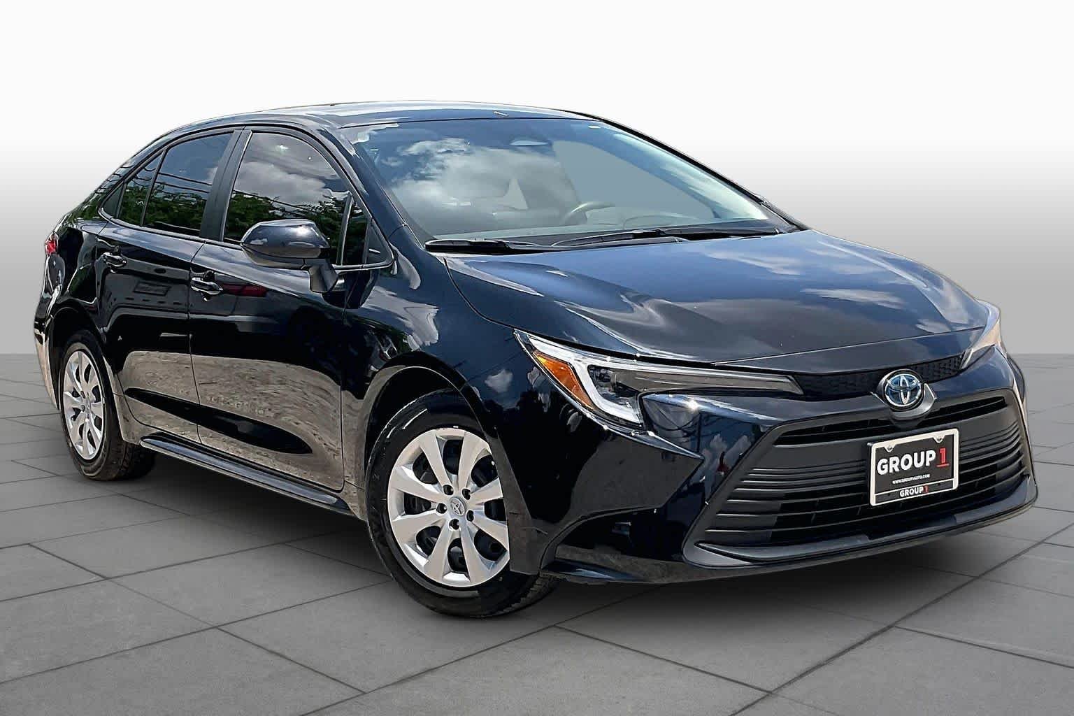 Used 2025 Midnight Black Metallic Toyota Hybrid LE image 3