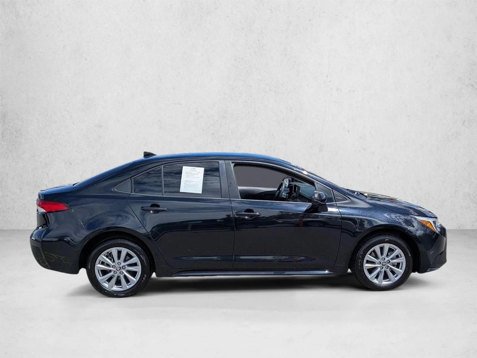 Used 2024 Midnight Black Metallic Toyota Hybrid LE image 4