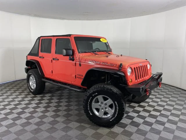 Used 2013 Red Jeep Unlimited Sport image 6