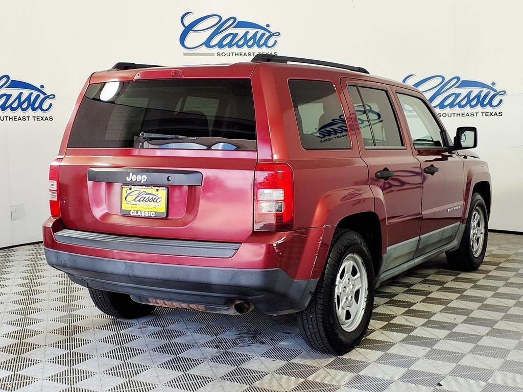Used 2011 Deep Cherry Red Jeep Sport image 6